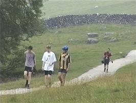 The slower walkers on the path to Malham Cove
